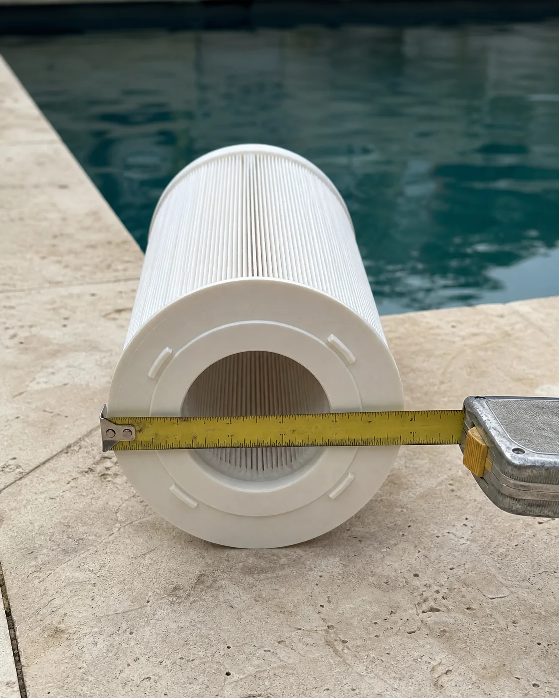 Tape measure across a pool filter cartridge end cap